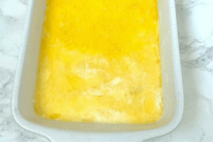 peach cobbler covered with butter