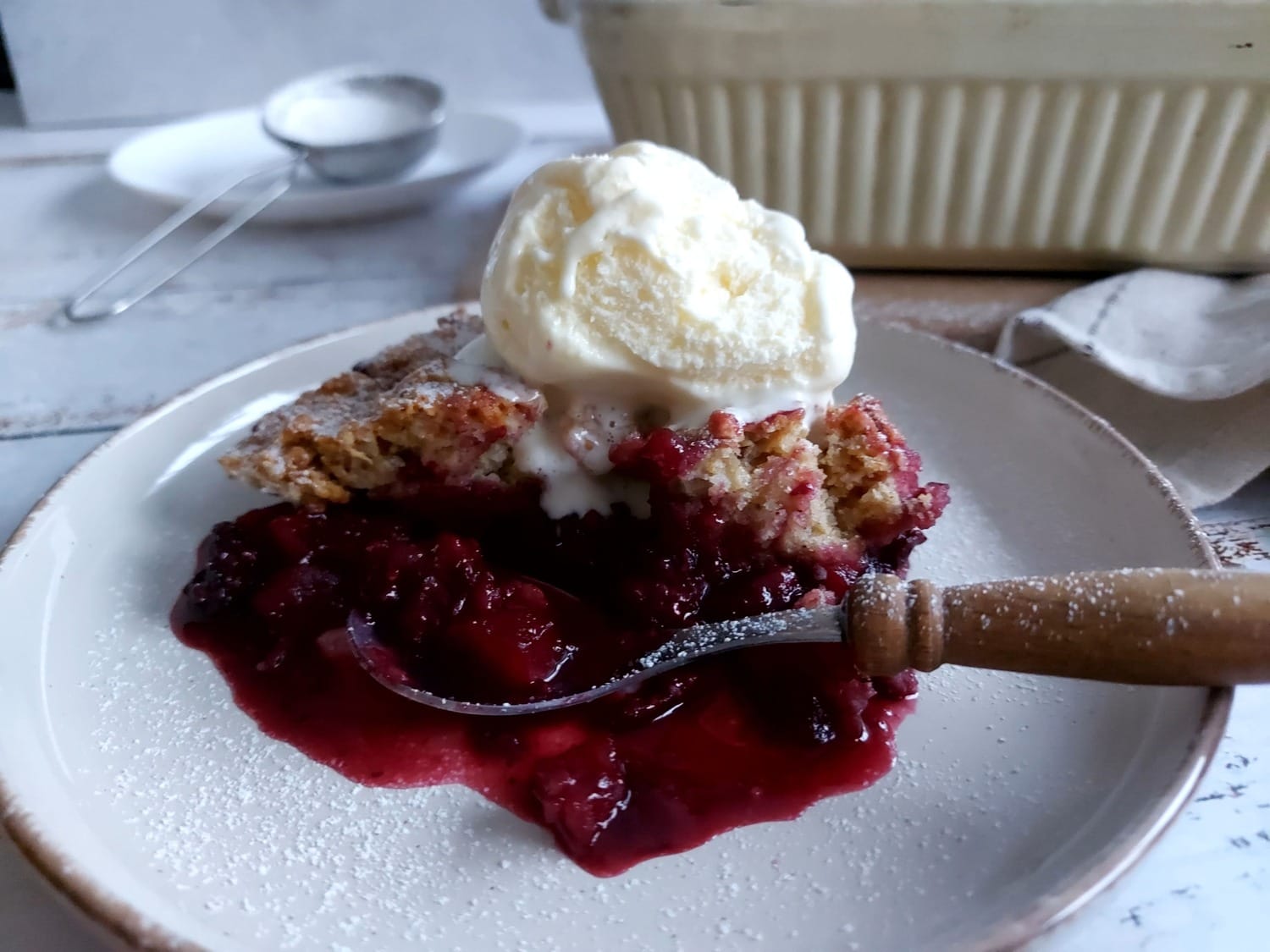 Blackberry Cobbler with a spoon on a plate