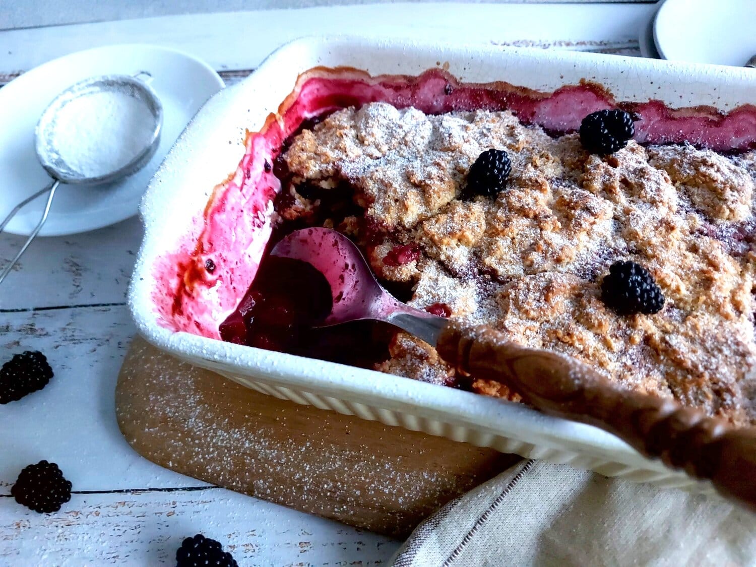 Cobbler in a tray with a spoon