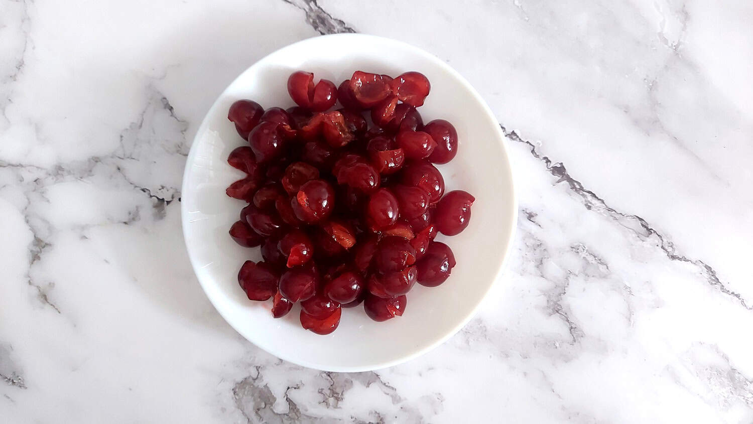 cherries on a white plate