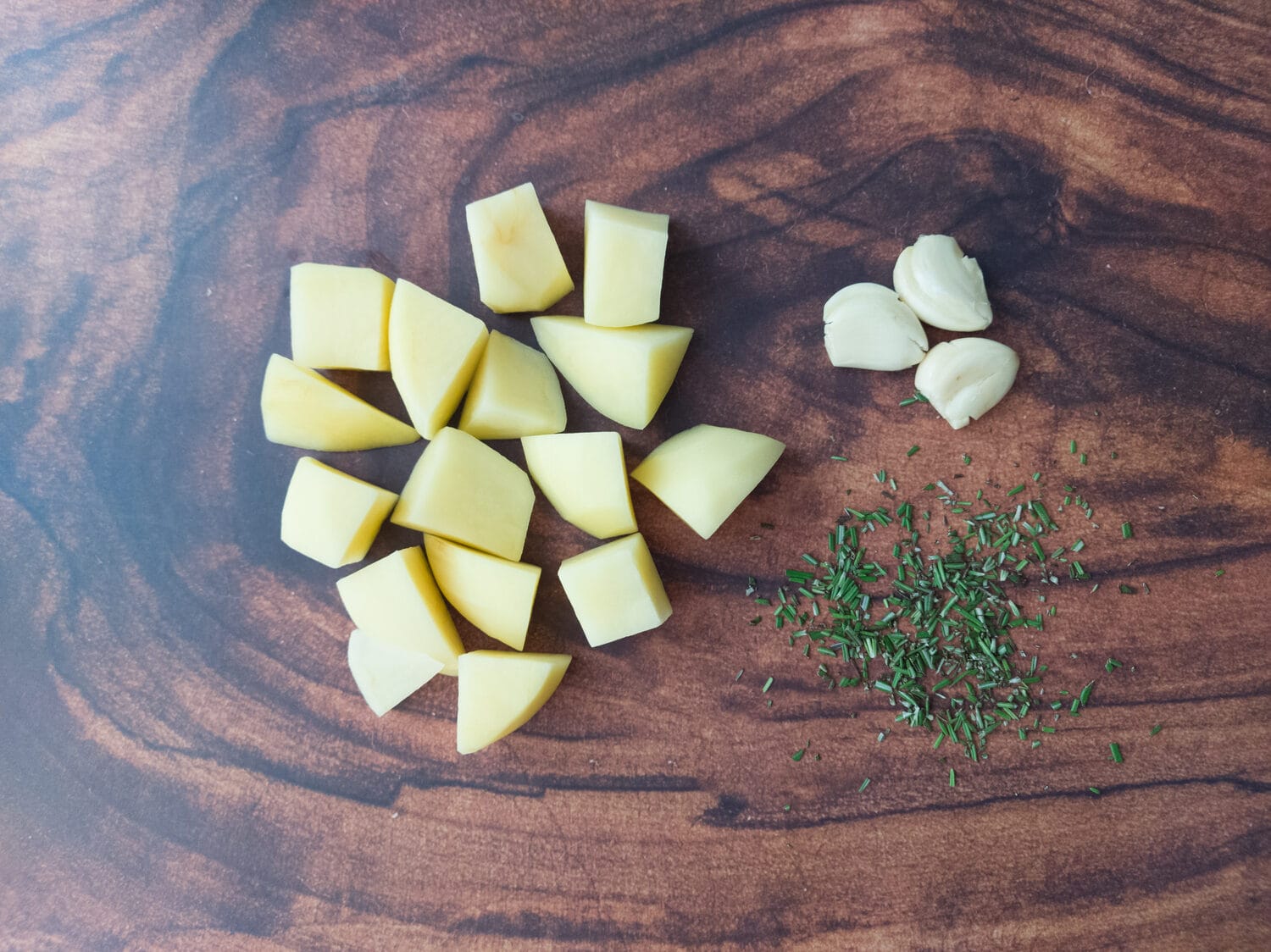 Cubed potatoes, smashed garlic, chopped rosemary