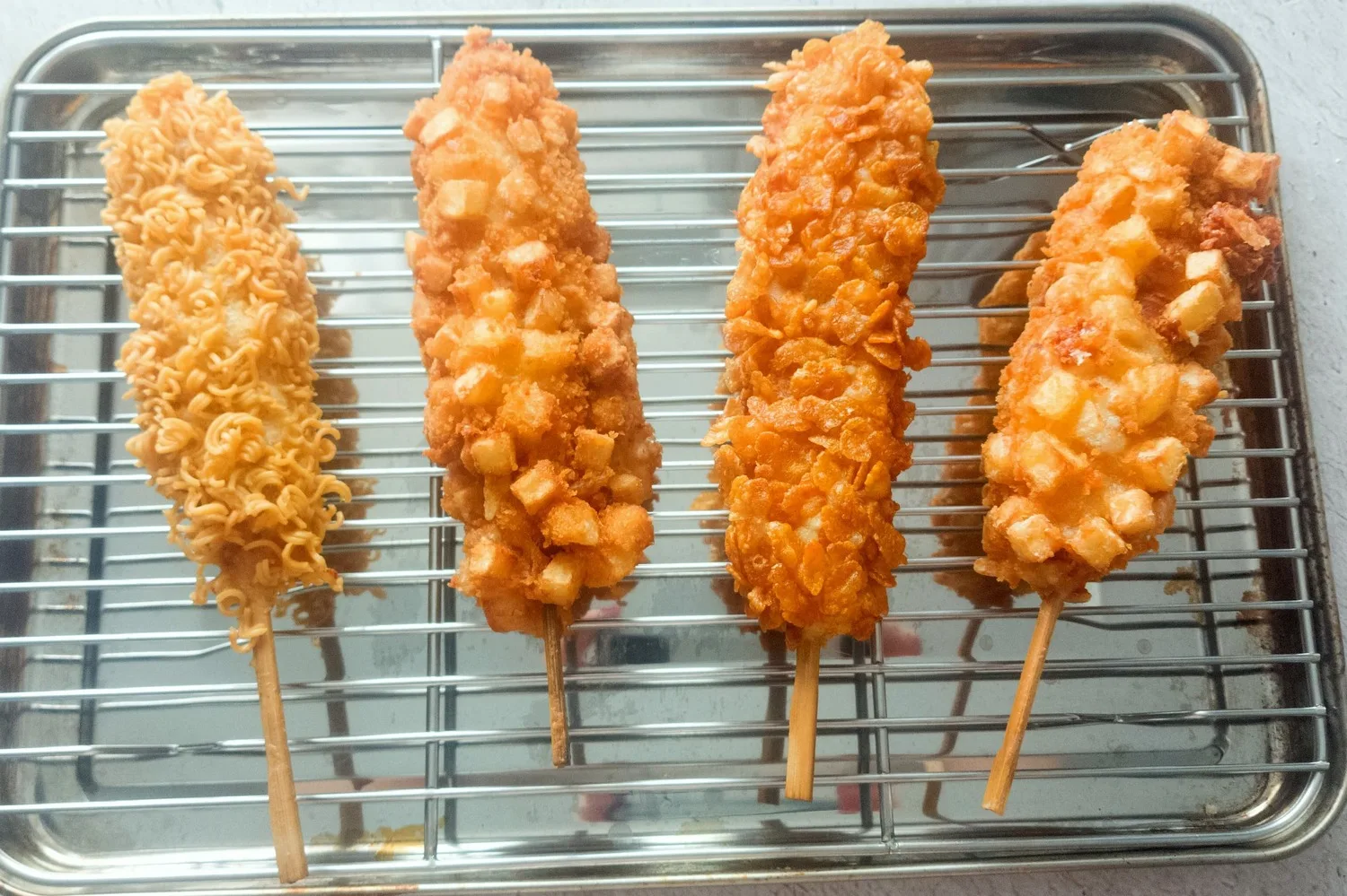 FRIED CORN DOGS ON A COOLING RACK