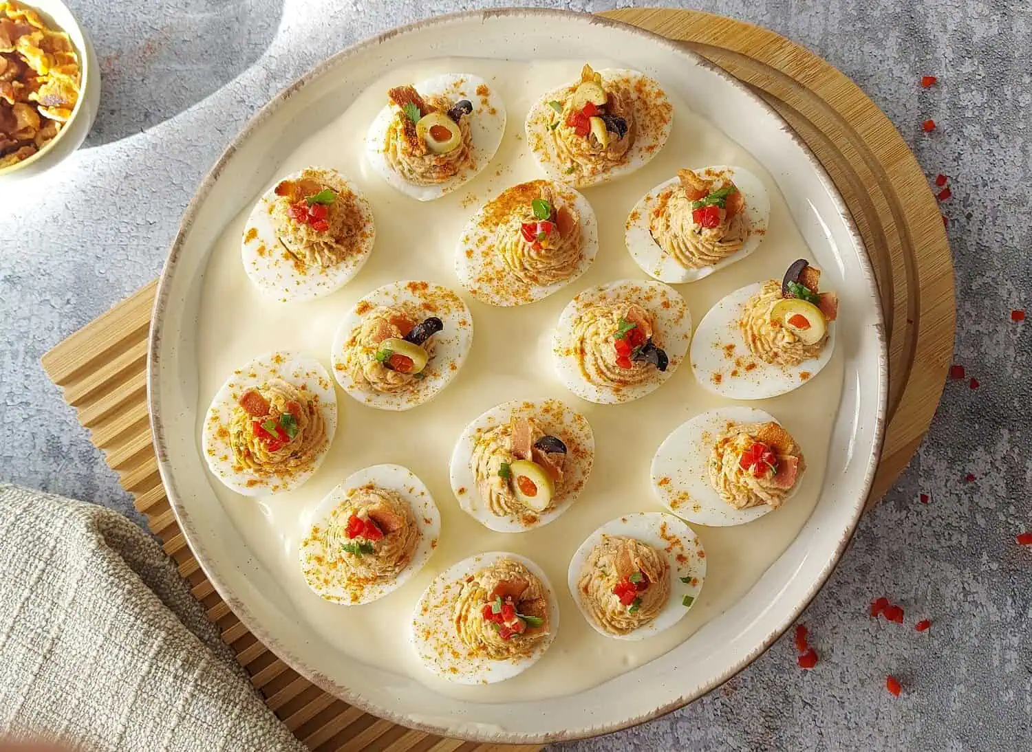 Plate with deviled eggs with bacon in a mayonnaise sauce