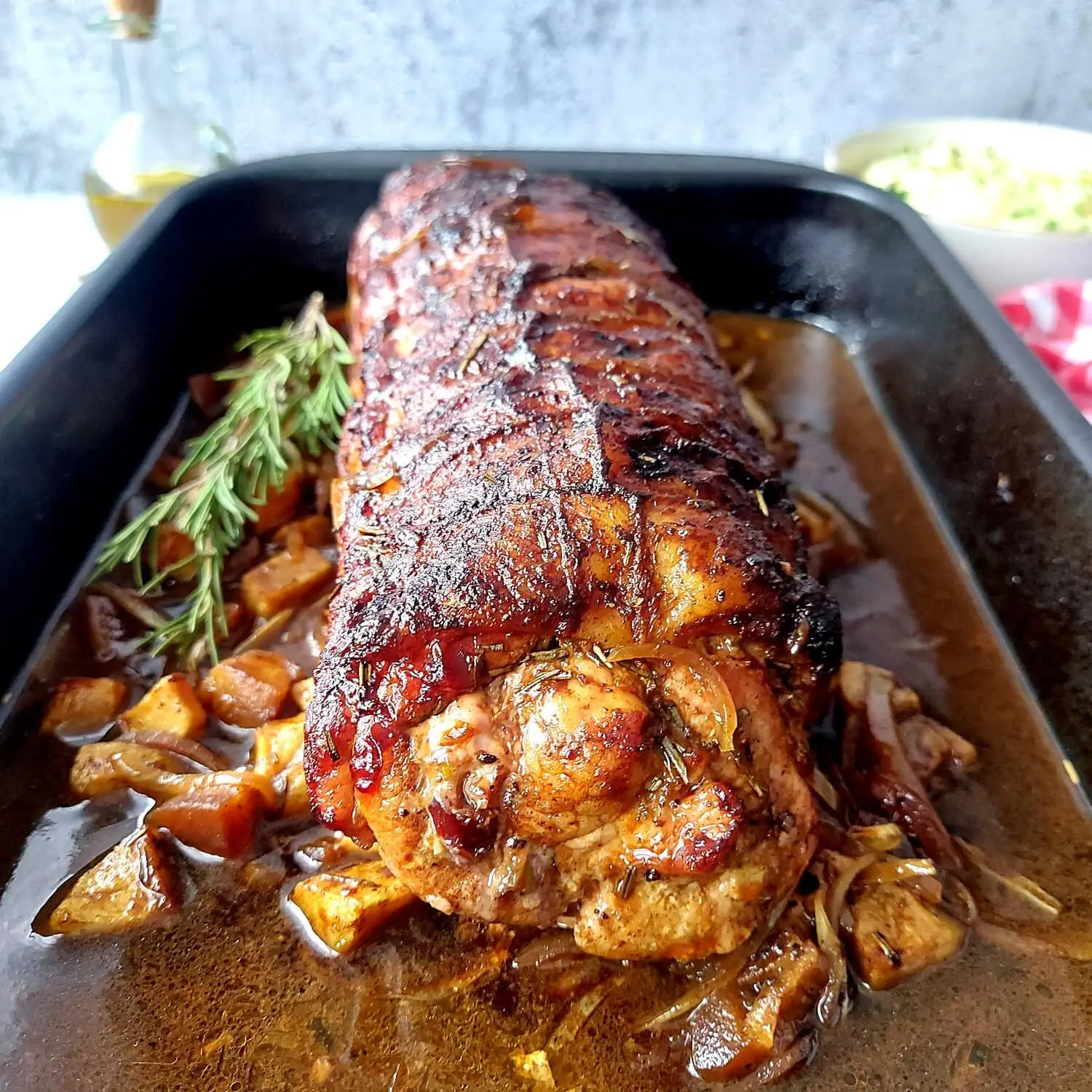 cranberry apple stuffed pork loin Eye level shot of a pork roast stuffed with apples