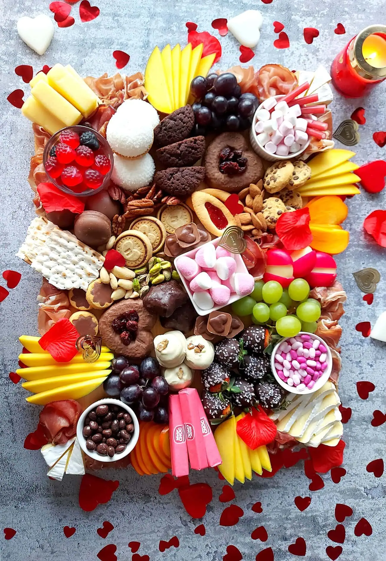 valentine's day charcuterie Complete Valentines Day Charcuterie with romantic heart-shaped festive touches and lit candle