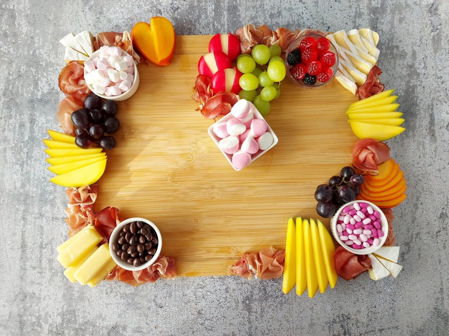 valentine's day charcuterie Romantic grazing board with cheeses, meats, fruits, candies and marshmallows