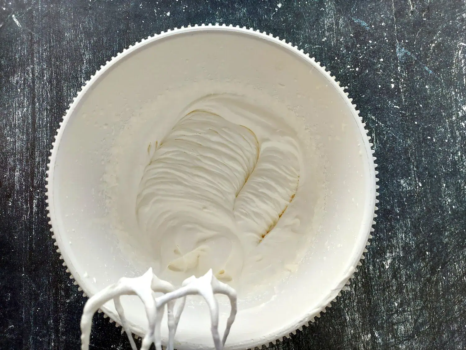 Whipped cream beaten to stiff peaks