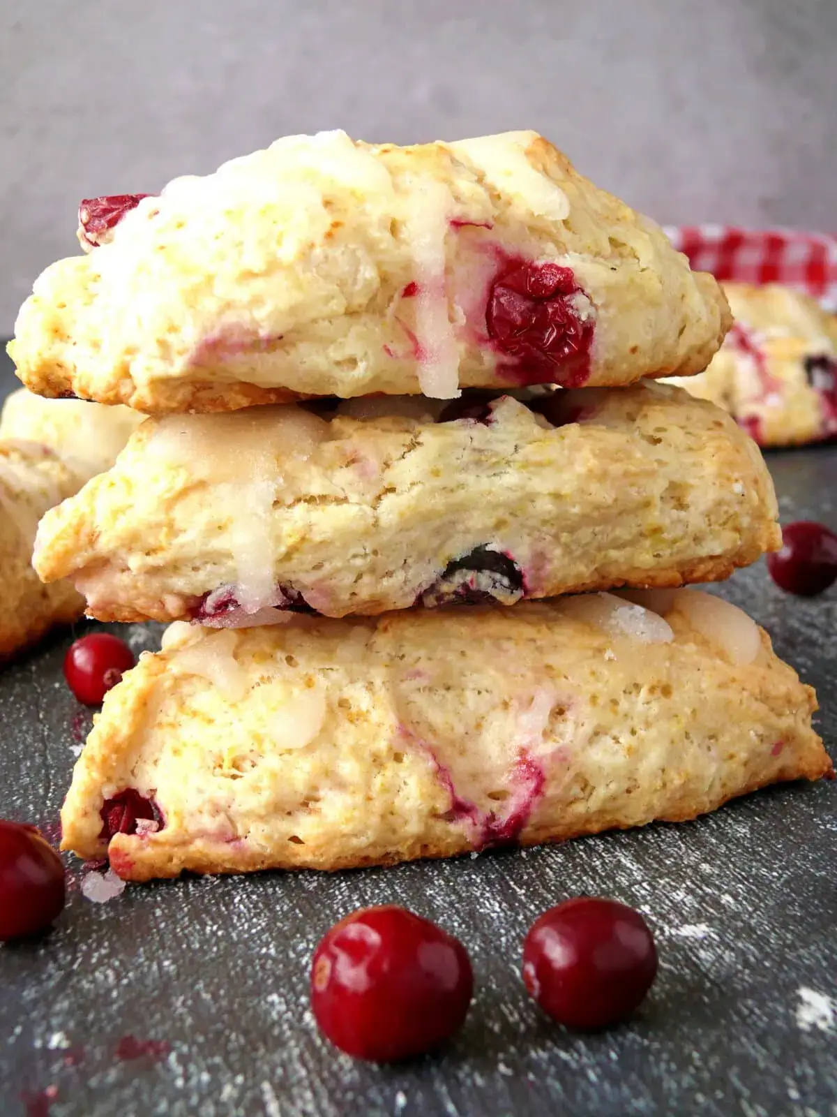 eggless scone recipe Eggless scones made with this eggless scone recipe stacked on top of each other with fresh cranberries around