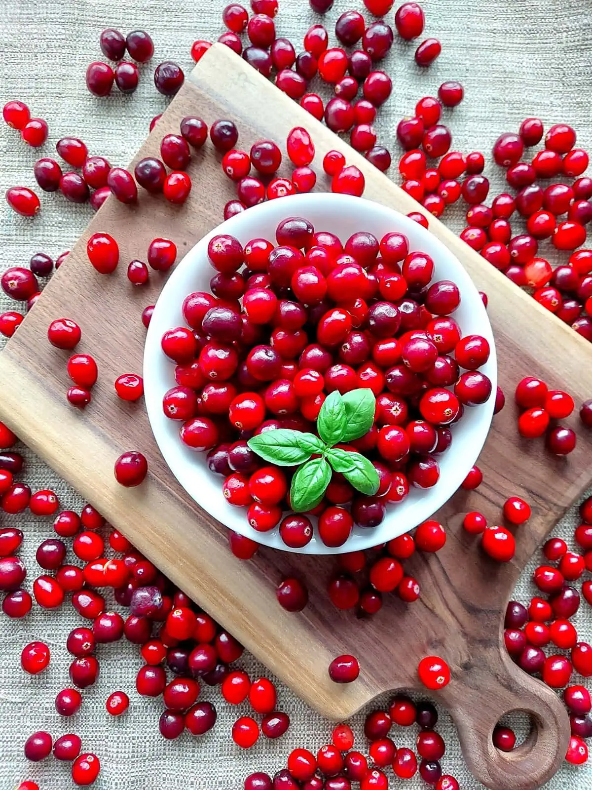 eggless scone recipe Fresh cranberries in a white bowl