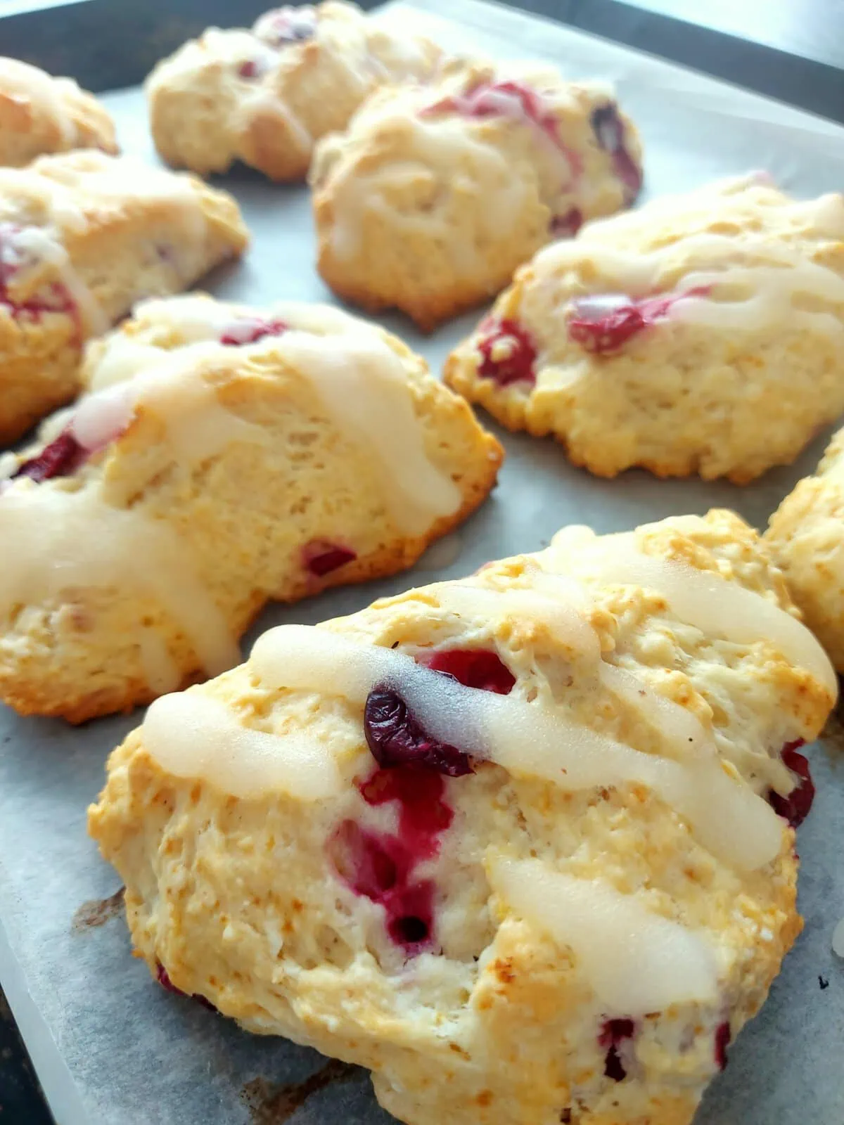 eggless scone recipe Close-up shot of a tray with lemon glazed eggless scones