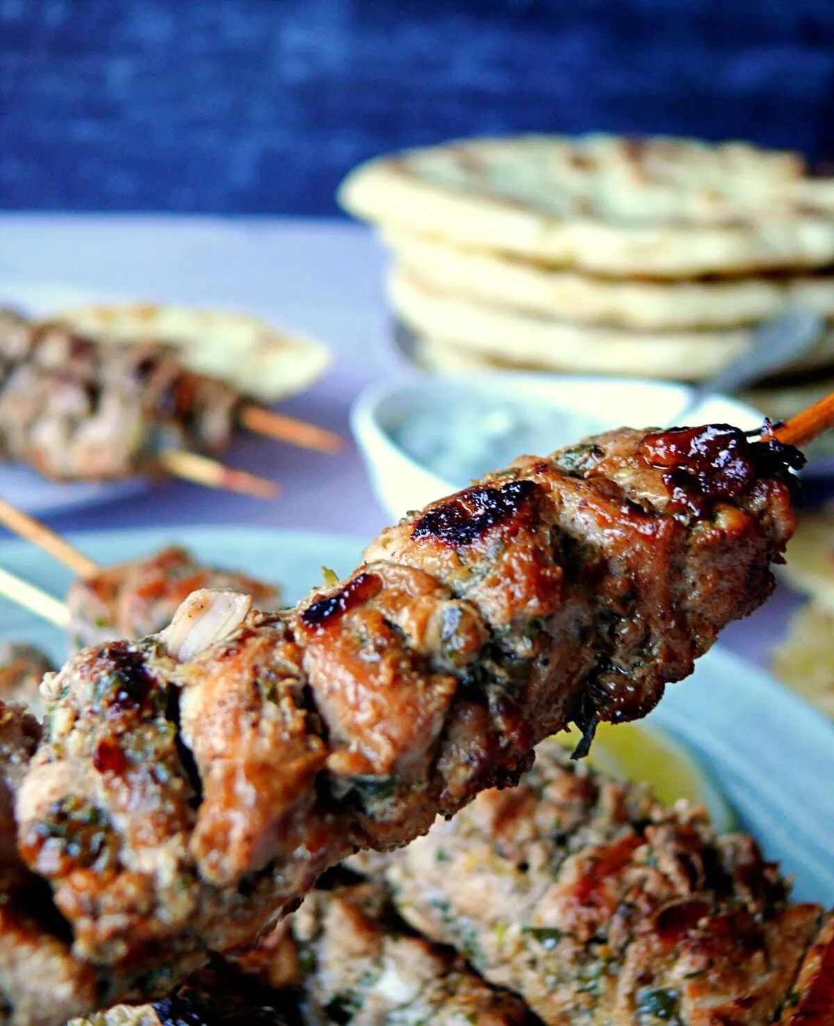 traditional greek souvlaki souvlaki chicken close-up shot with pita bread in the background
