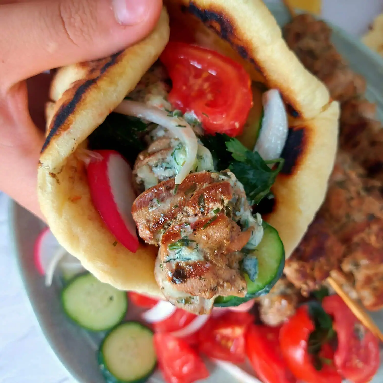 Greek pita bread filled with grilled chicken and vegetables