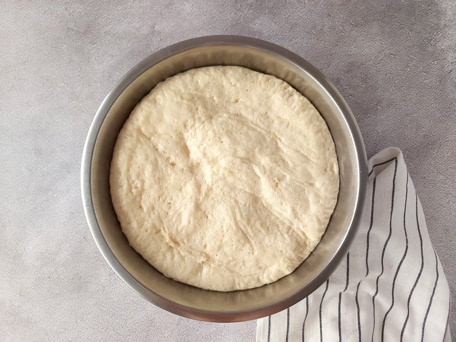 risen dough for greek pita bread in a bowl