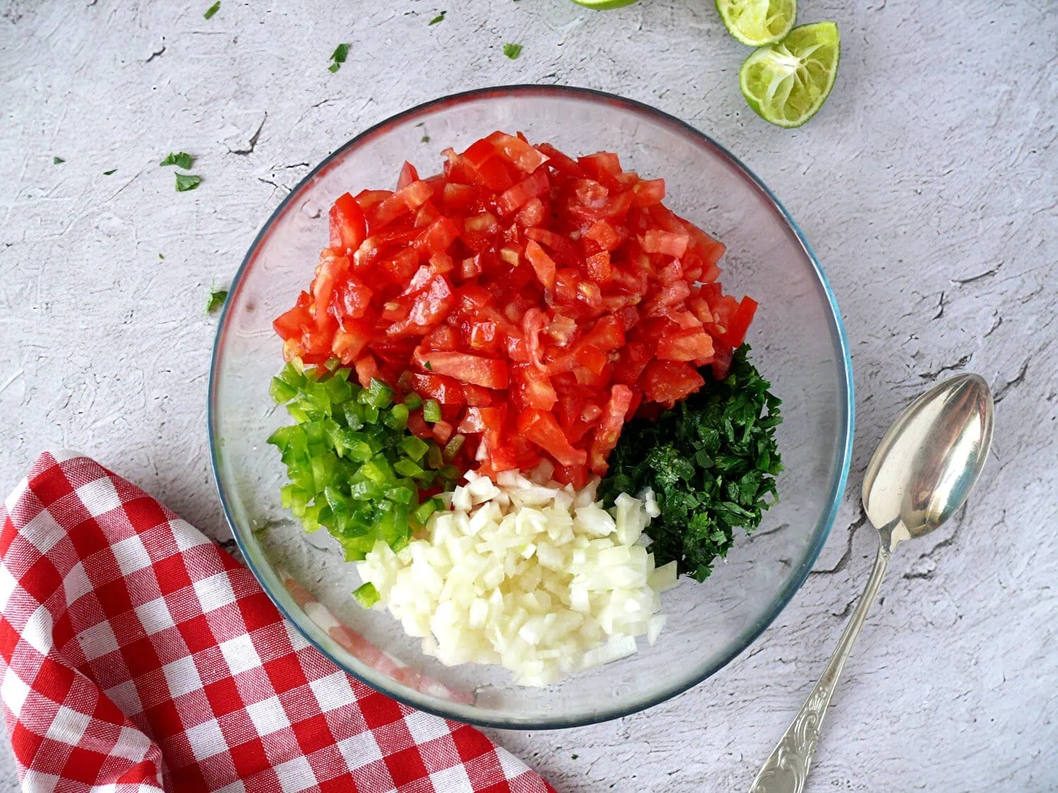 fresh pico de gallo recipe Glass bowl with tomatoes, onion, parsley, bell peppers, lime juice and salt