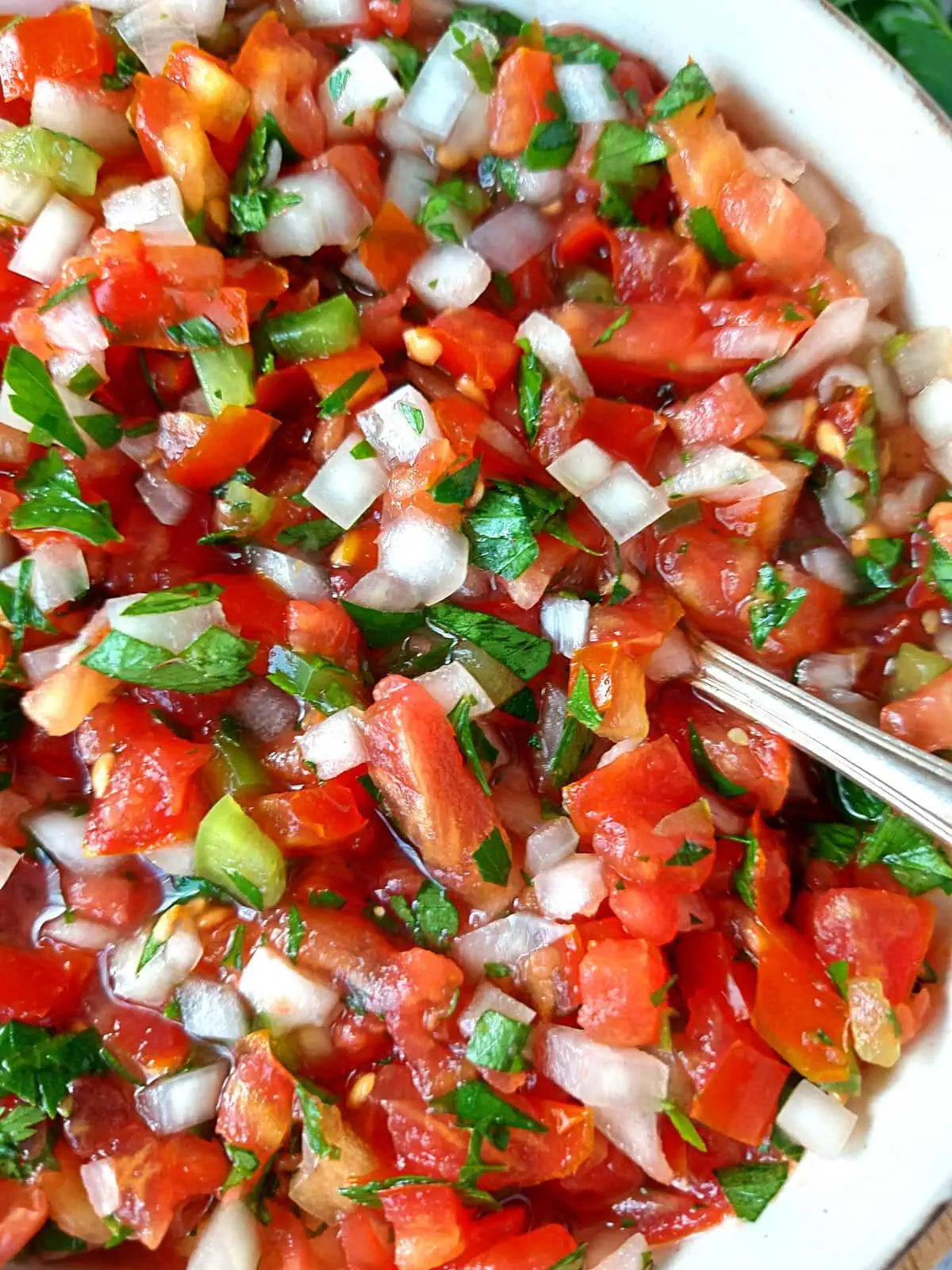 fresh pico de gallo recipe Close-up of fresh homemade pico de gallo with vine tomatoes, onion, parsley, and lime juice